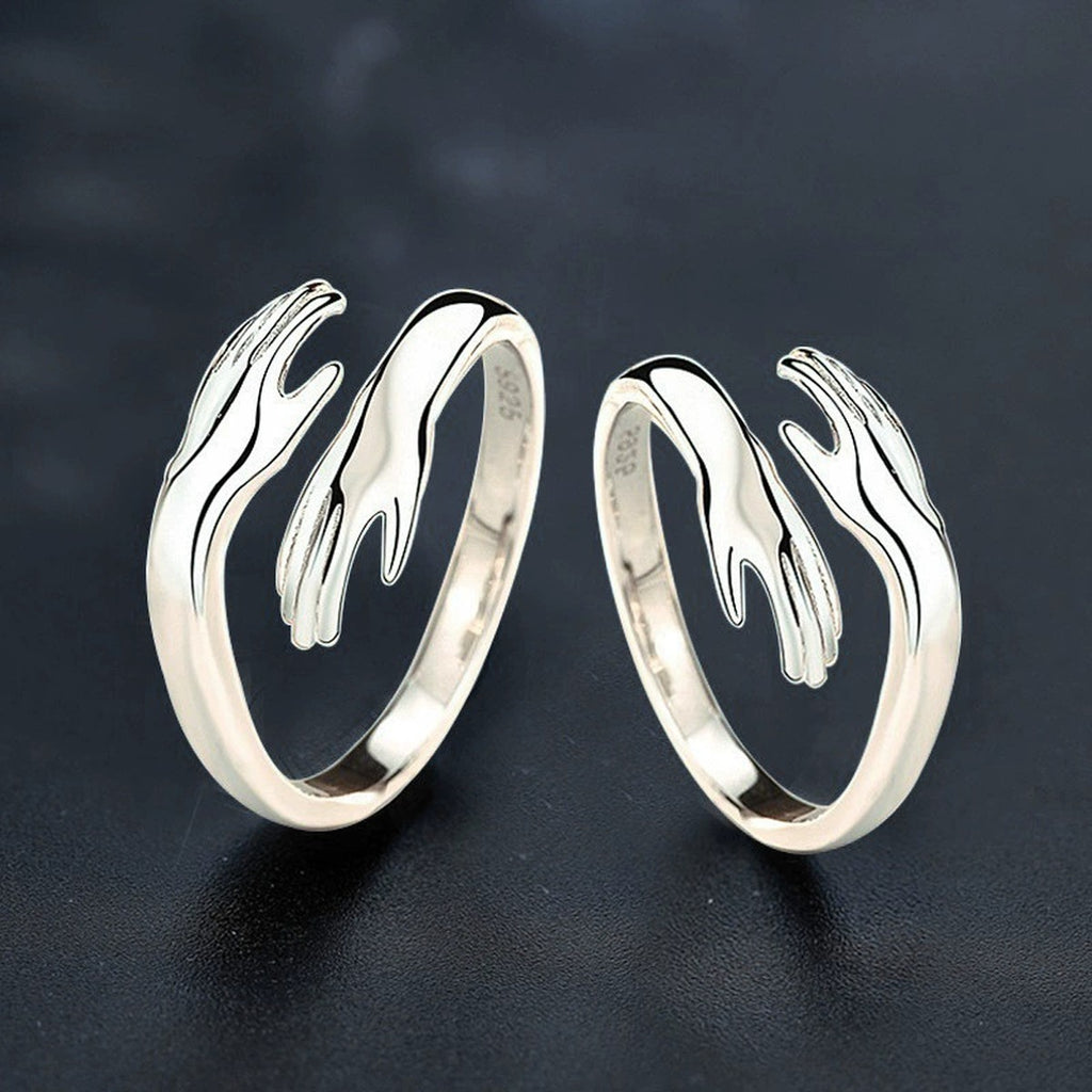 Embrace Motif Couples Adjustable Rings close-up detail view with moissanite sparkle