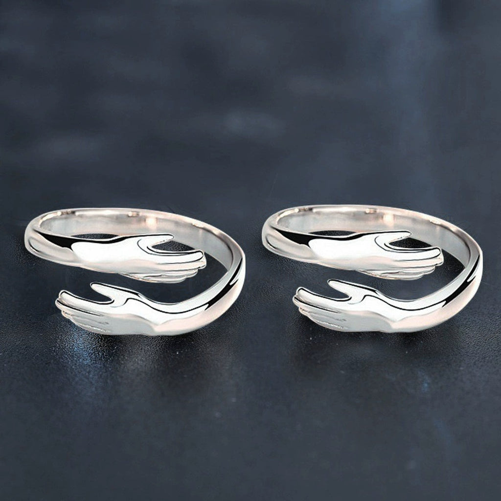 Embrace Motif Couples Adjustable Rings close-up detail view with moissanite sparkle