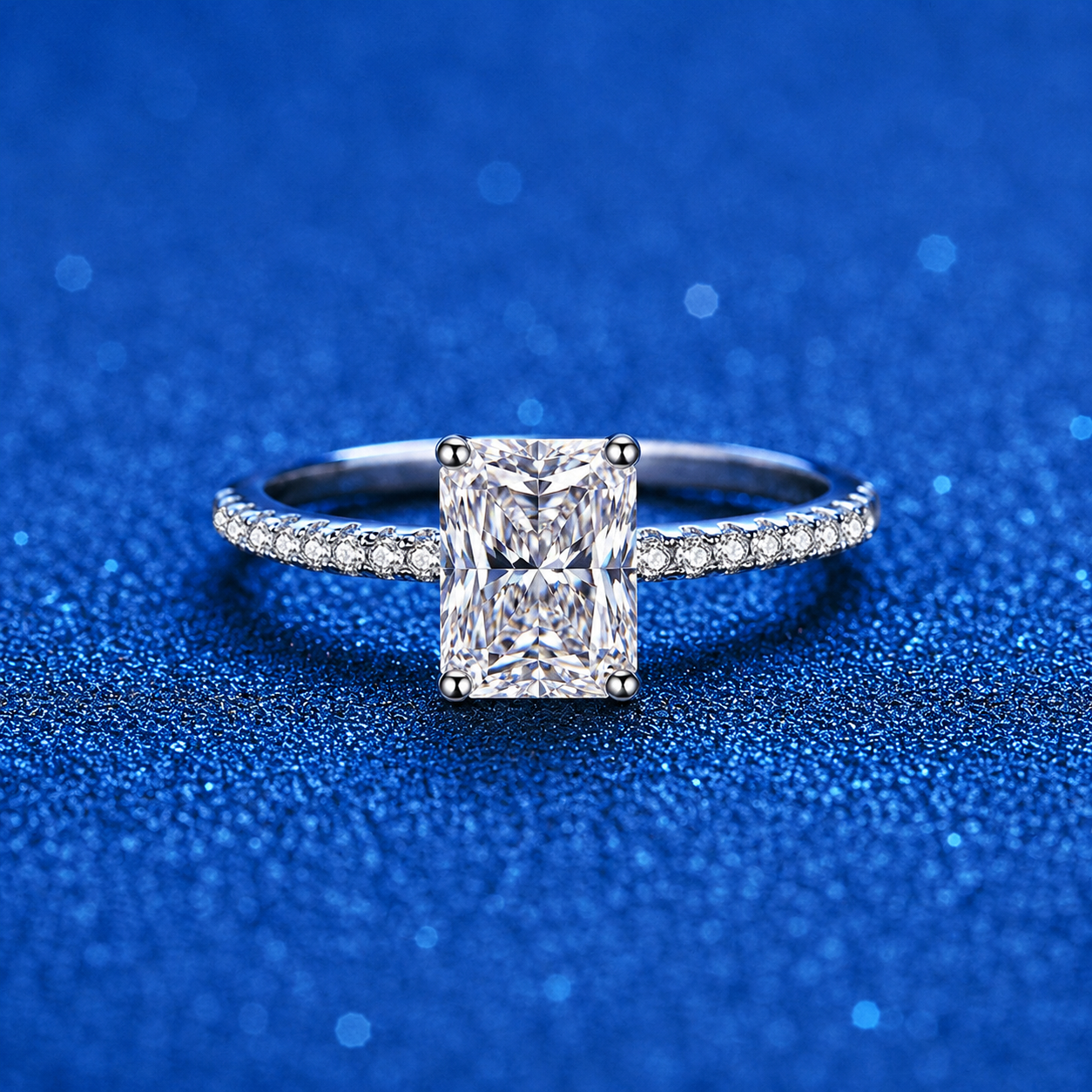 Emerald and Radiant Cut Moissanite Ring with CZ blue background product view
