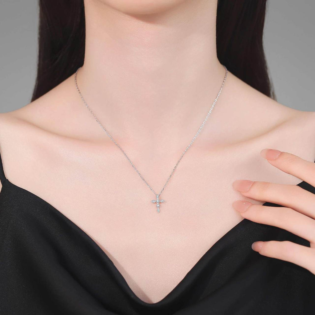 Model wearing a delicate S925 sterling silver moissanite cross necklace