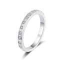 Round Moissanite Eternity Band Ring in rhodium-plated S925 sterling silver on clean white background