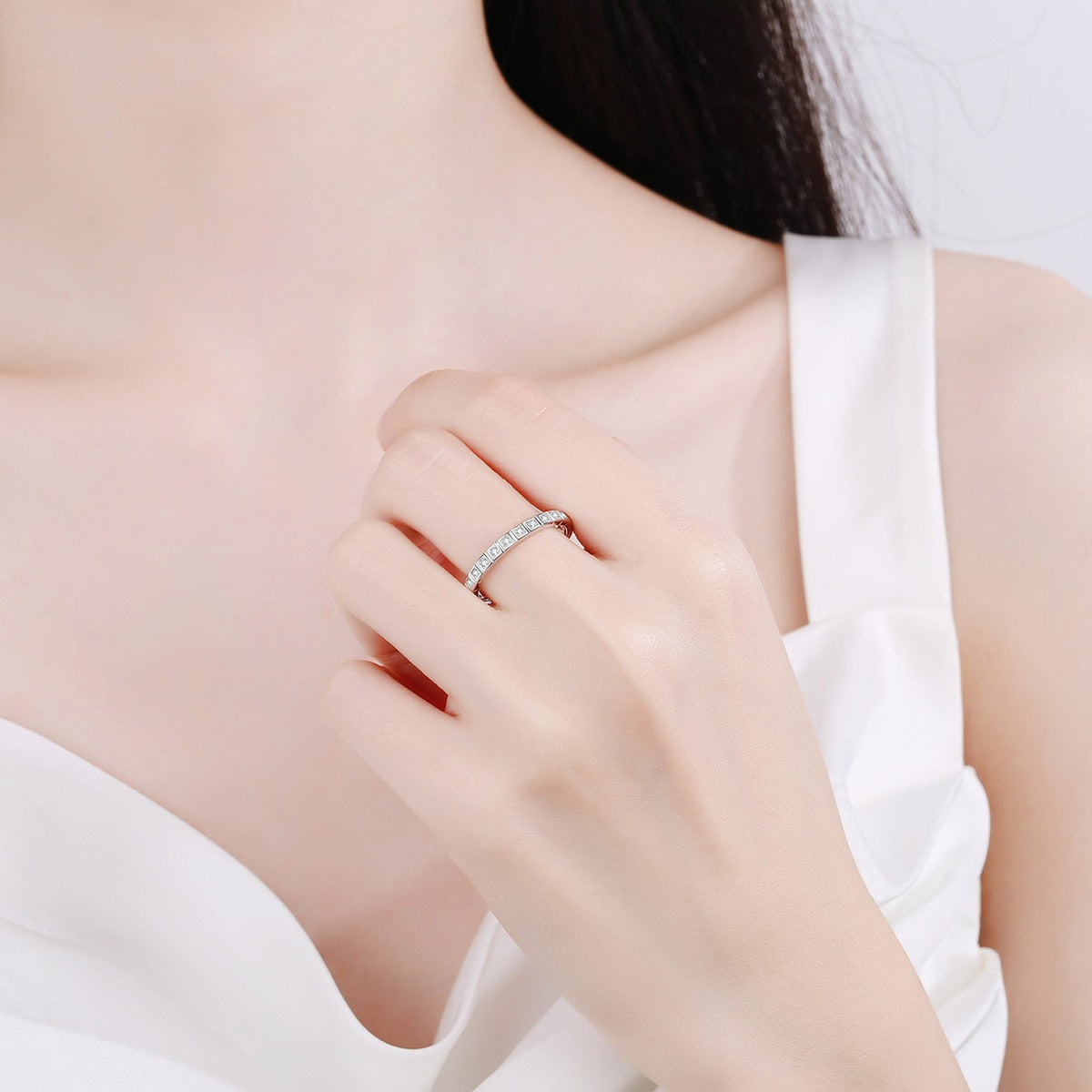 Round Moissanite Eternity Band Ring worn on hand to show scale, band width, and ring profile