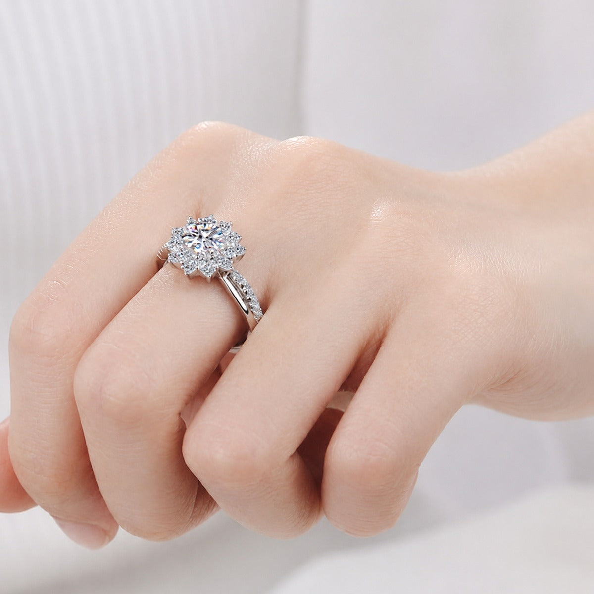 Round Moissanite Halo Engagement Ring with CZ worn on hand to show scale, band width, and ring profile