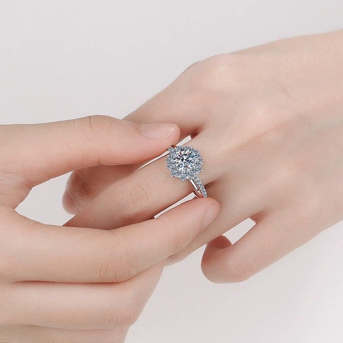 Round Moissanite Halo Engagement Ring with CZ worn on hand to show scale, band width, and ring profile