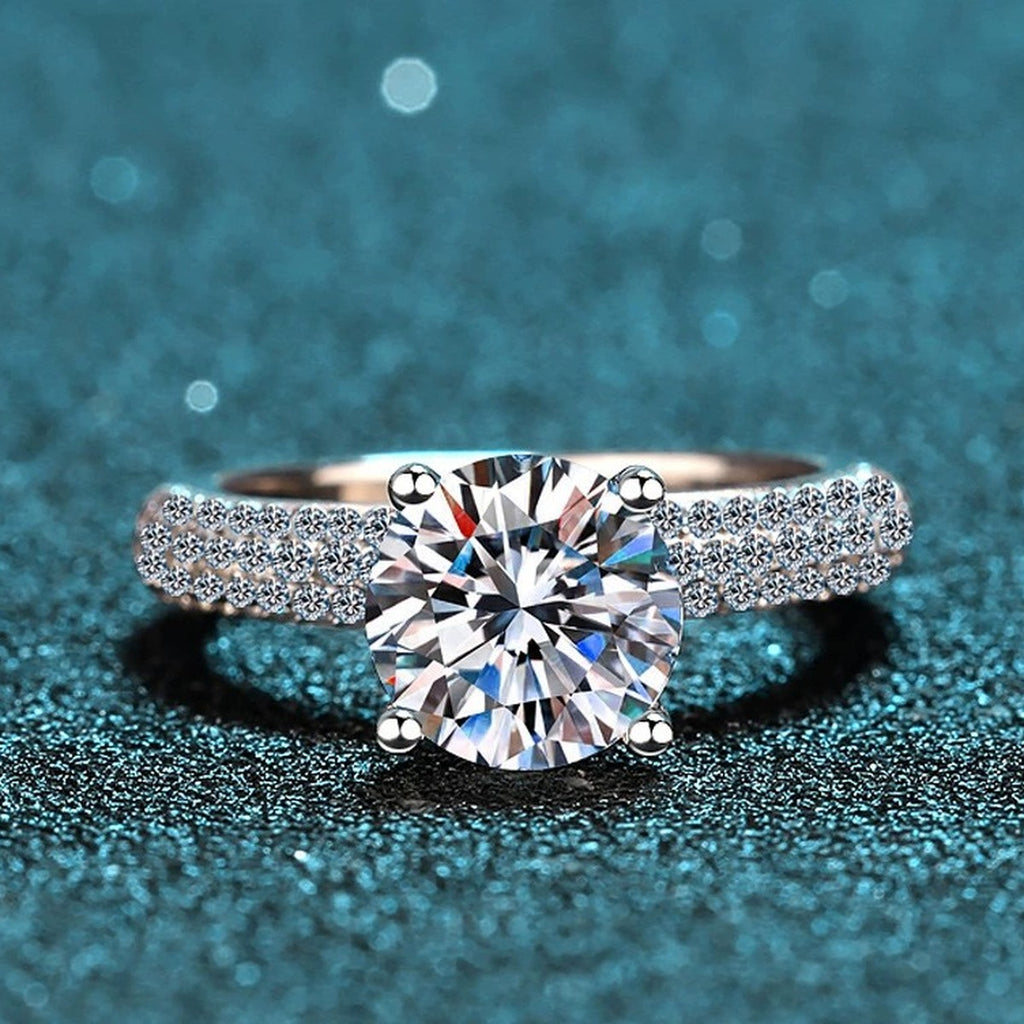 Round Moissanite Side Stone Engagement Ring with CZ product view showing moissanite setting and metal finish