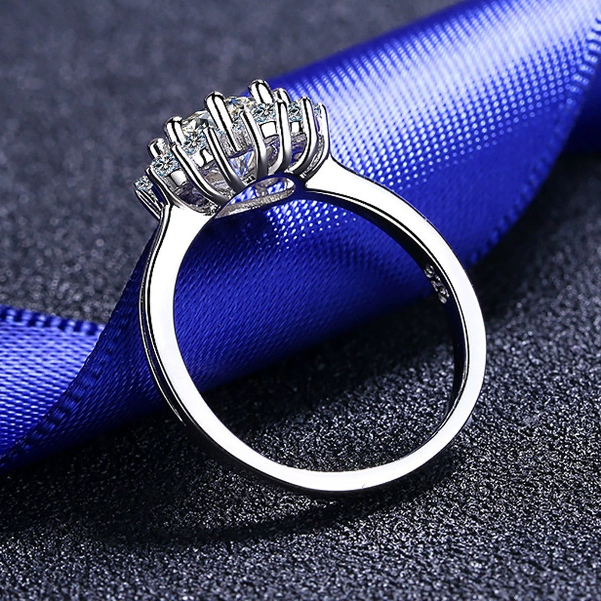Round Moissanite Side Stone Engagement Ring with CZ product view showing moissanite setting and metal finish