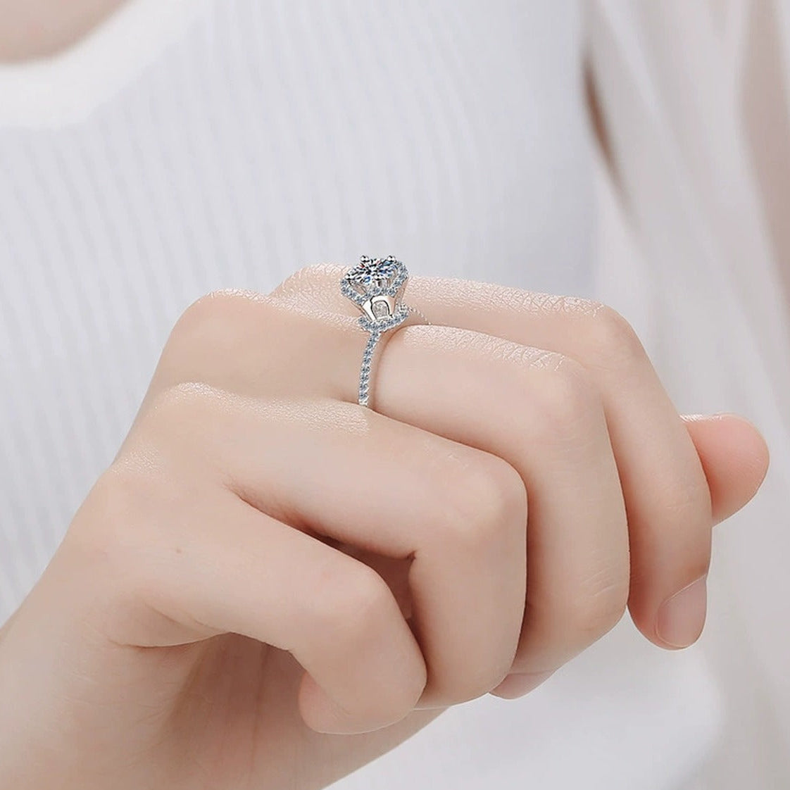 Round Moissanite Side Stone Ring with CZ worn on hand to show scale, band width, and ring profile