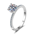 Round Moissanite Side Stone Ring with CZ in rhodium-plated S925 sterling silver on clean white background