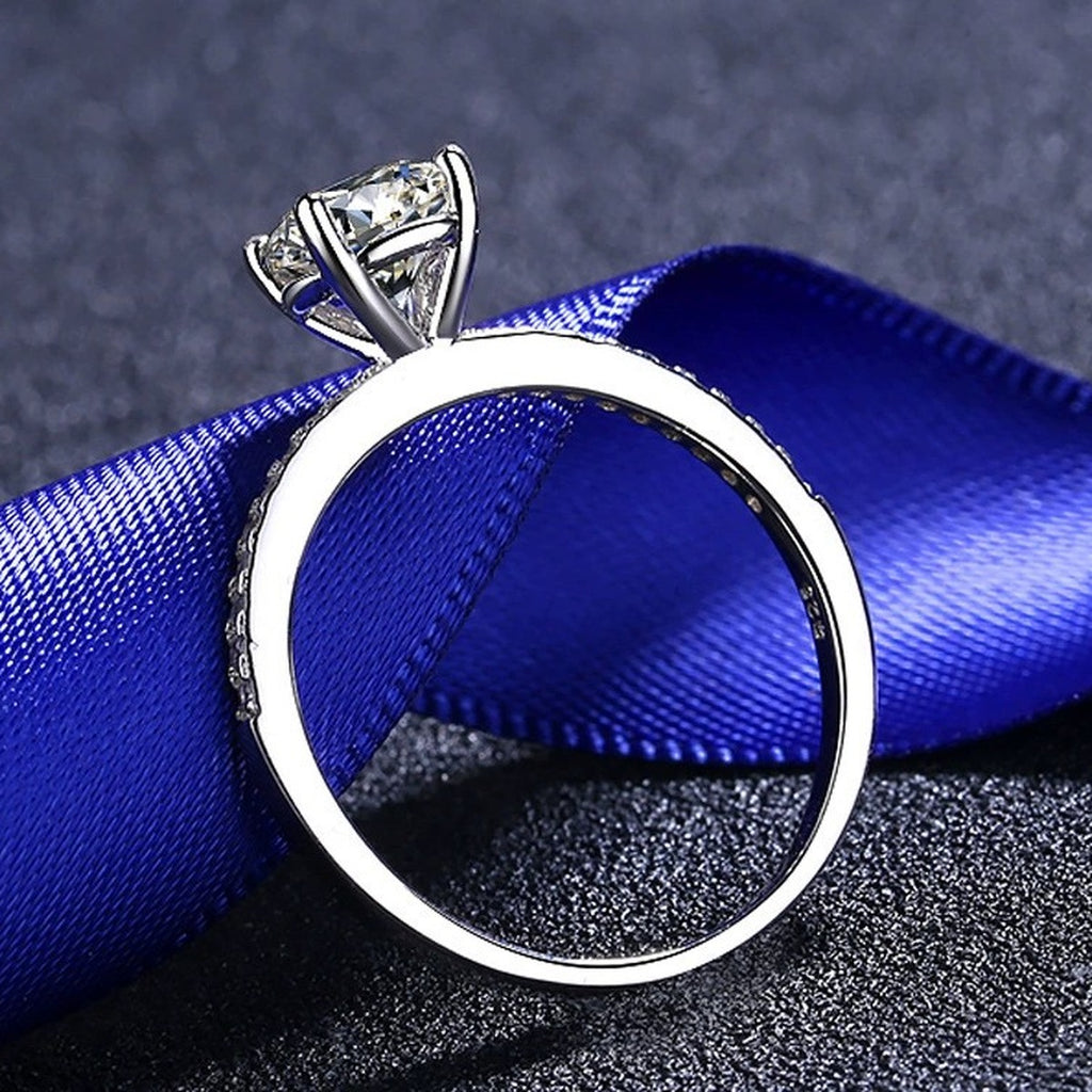 Round Moissanite Side Stone Ring with CZ product view showing moissanite setting and metal finish