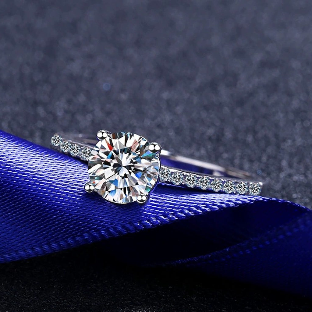 Round Moissanite Side Stone Ring with CZ product view showing moissanite setting and metal finish
