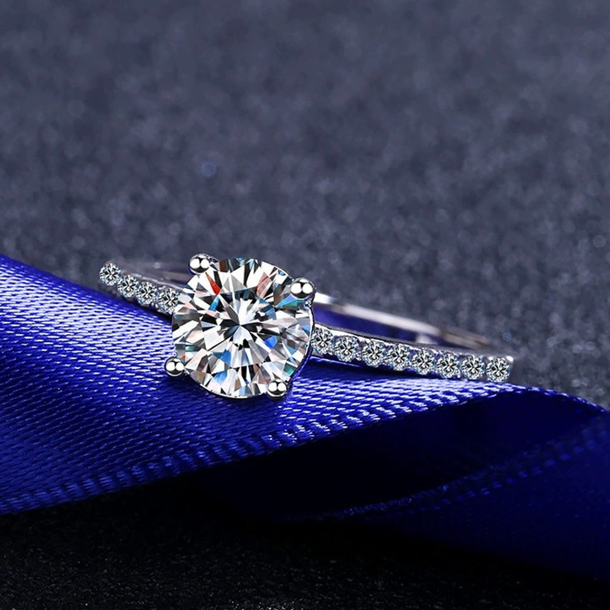 Round Moissanite Side Stone Ring with CZ product view showing moissanite setting and metal finish