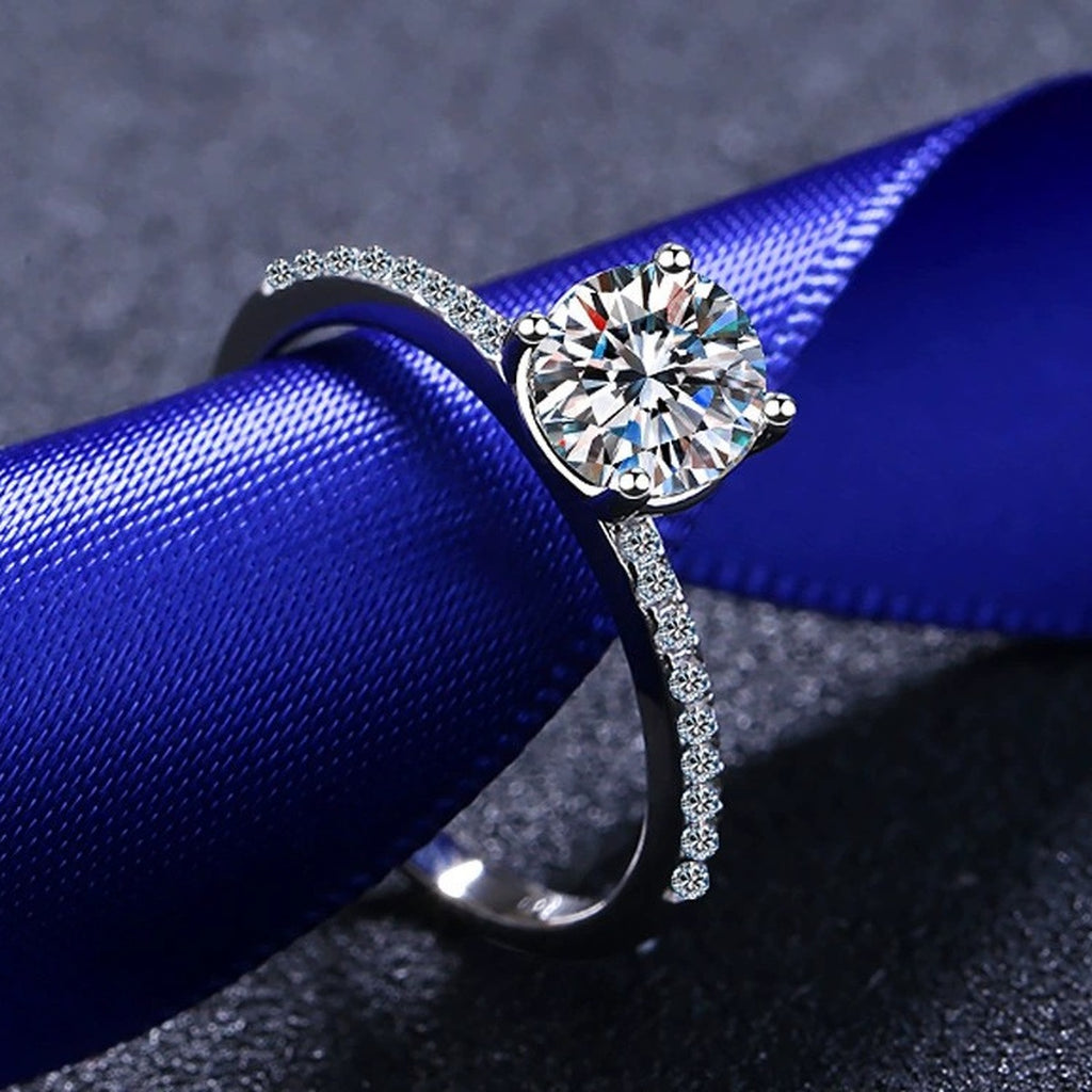 Round Moissanite Side Stone Ring with CZ product view showing moissanite setting and metal finish