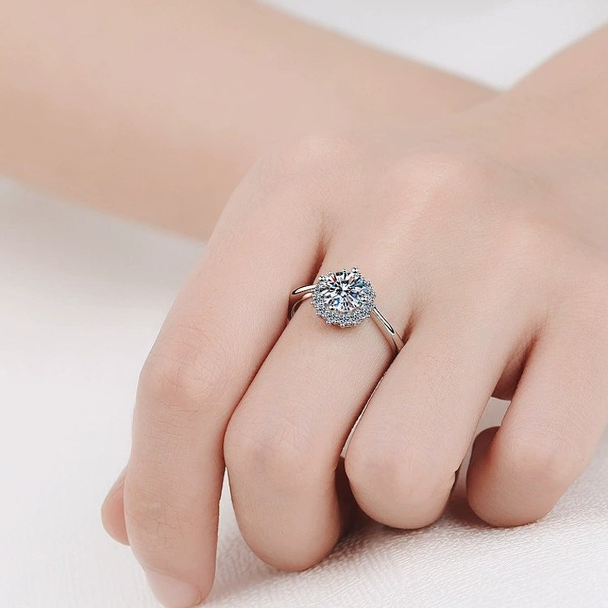 Round Moissanite Halo Engagement Ring with CZ worn on hand to show scale, band width, and ring profile