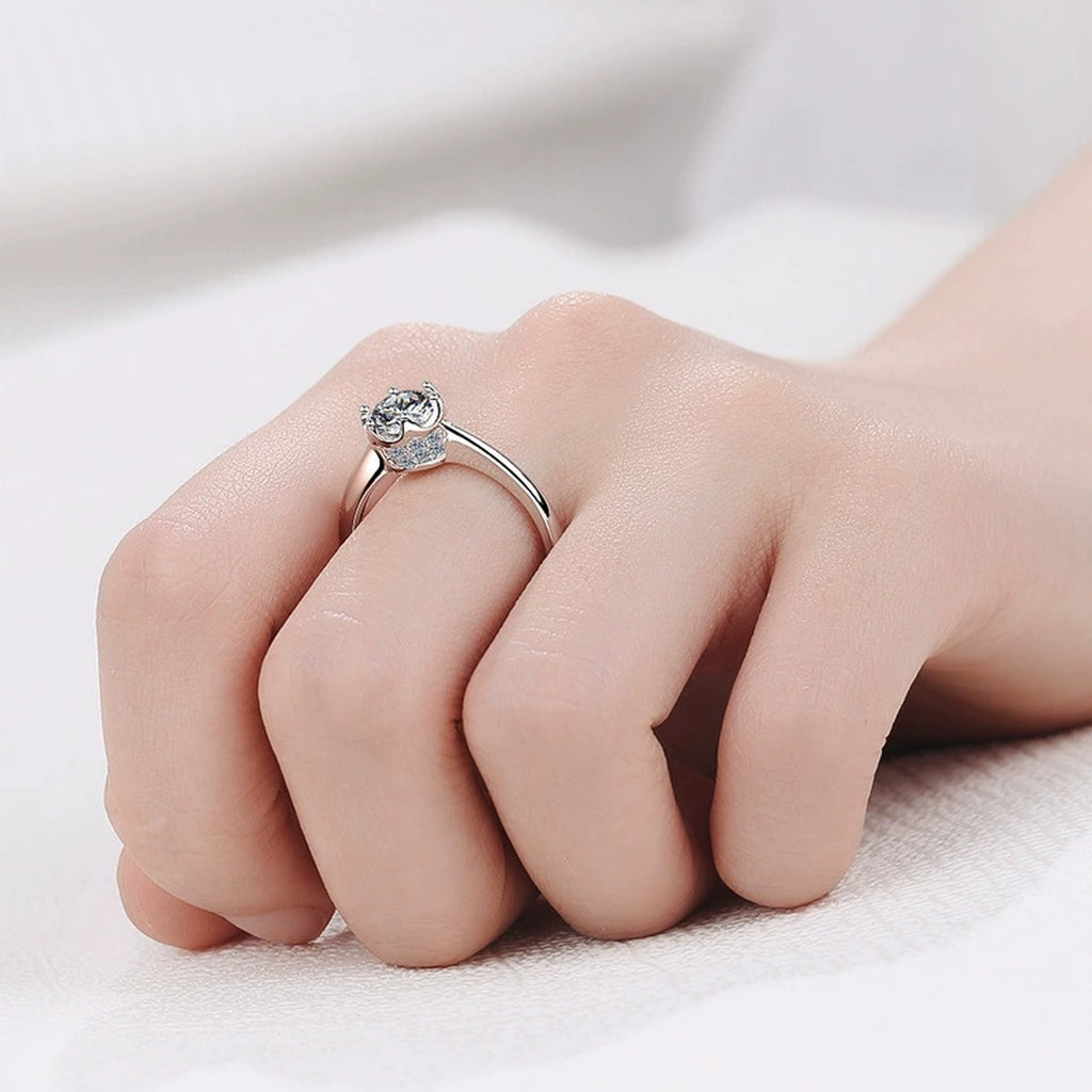 Round Moissanite Solitaire Ring with CZ worn on hand to show scale, band width, and ring profile