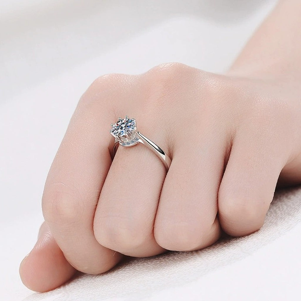 Round Moissanite Side Stone Ring with CZ worn on hand to show scale, band width, and ring profile