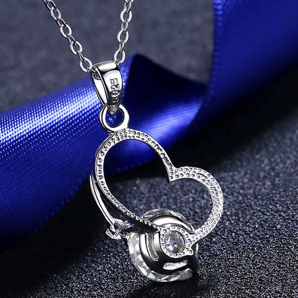 Love Heart Moissanite Pendant Necklace in Rhodium-Plated S925 sterling silver product scene view showing chain and setting detail
