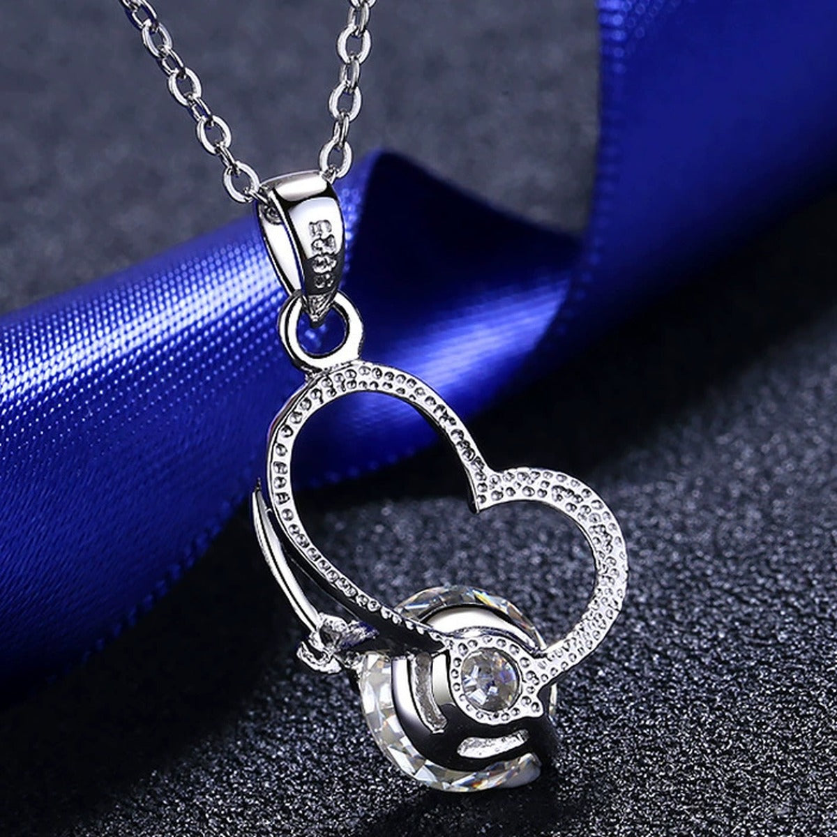 Love Heart Moissanite Pendant Necklace in Rhodium-Plated S925 sterling silver product scene view showing chain and setting detail