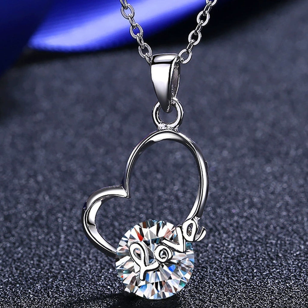 Love Heart Moissanite Pendant Necklace in Rhodium-Plated S925 sterling silver product scene view showing angled sparkle