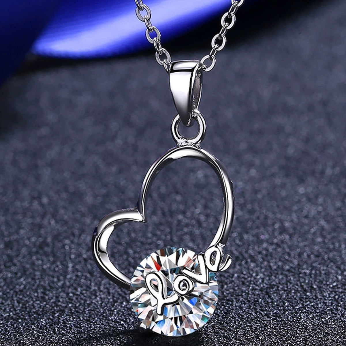 Love Heart Moissanite Pendant Necklace in Rhodium-Plated S925 sterling silver product scene view showing angled sparkle