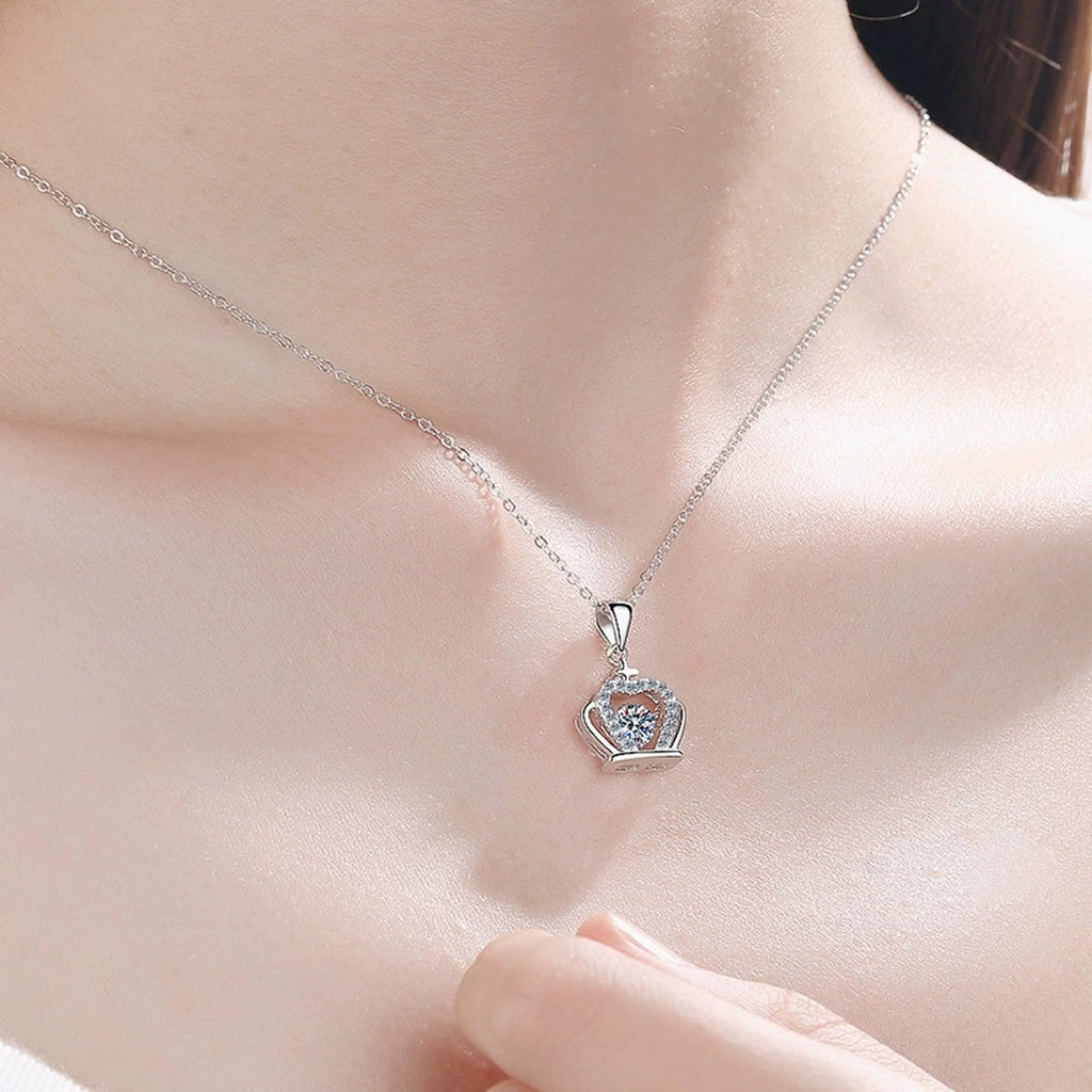 Crown Moissanite Pendant Necklace with CZ in Rhodium-Plated S925 sterling silver worn on neckline by model showing scale and adjustable chain styling
