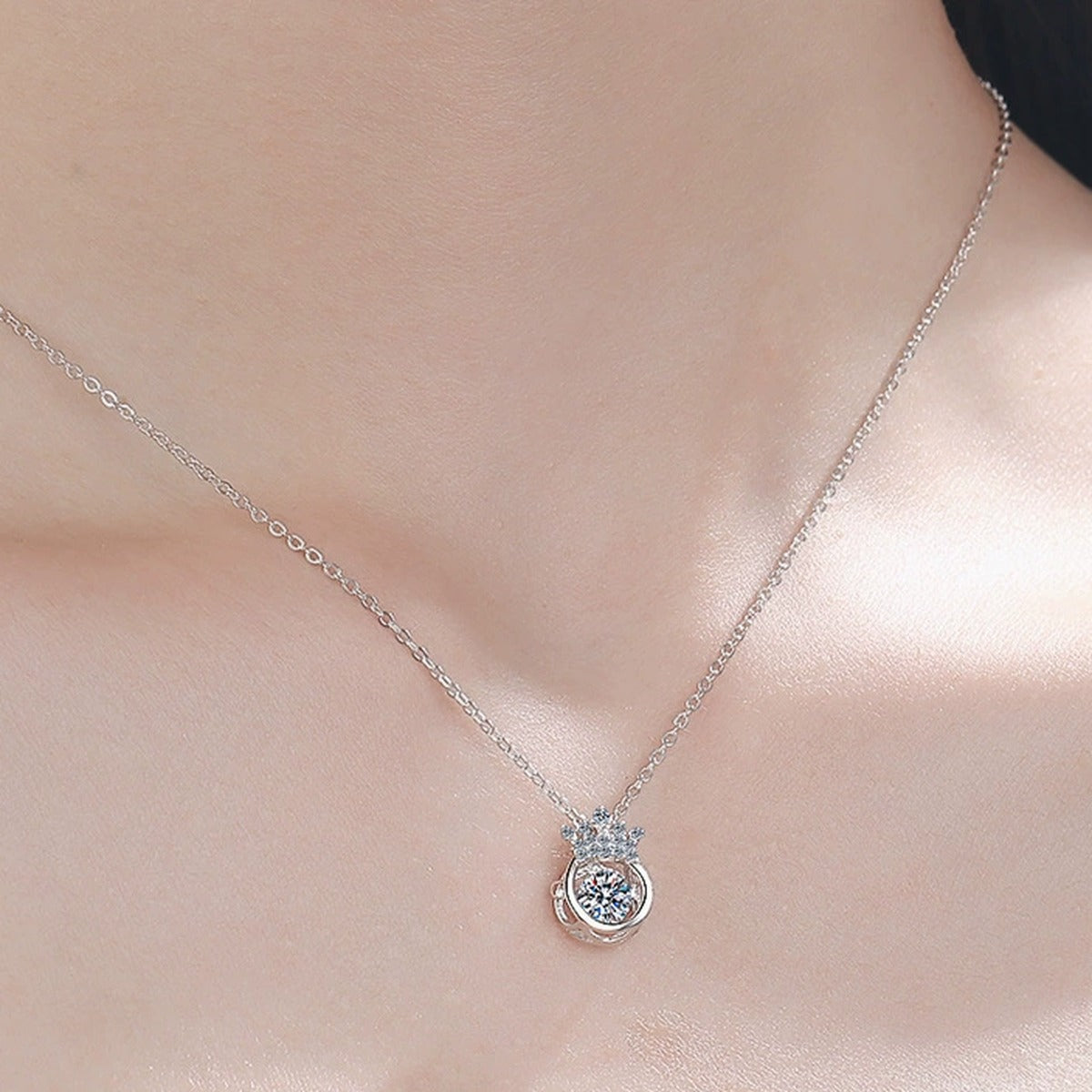 Crown Halo Moissanite Pendant Necklace with CZ in Rhodium-Plated S925 sterling silver worn on neckline by model showing scale and adjustable chain styling