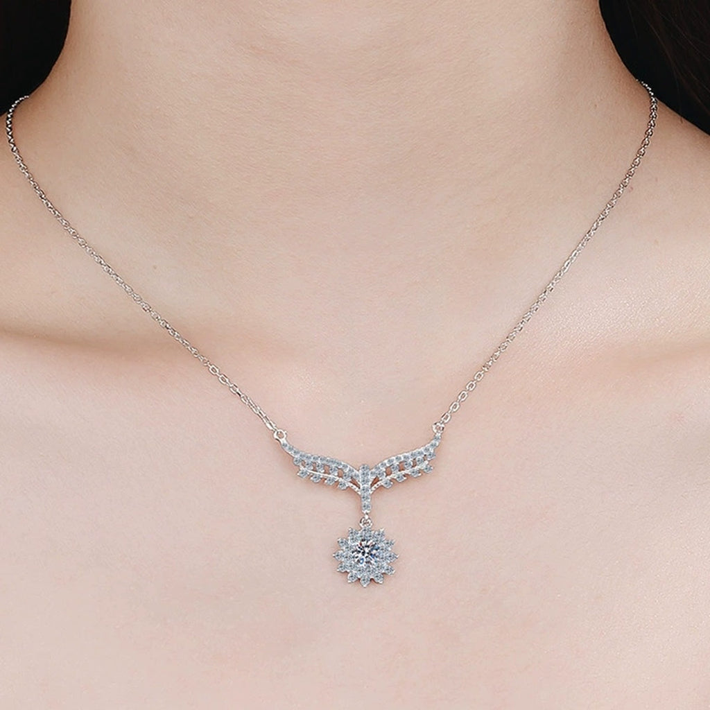 Angel Wing Moissanite Pendant Necklace with CZ in Rhodium-Plated S925 sterling silver worn on neckline by model showing scale and adjustable chain styling