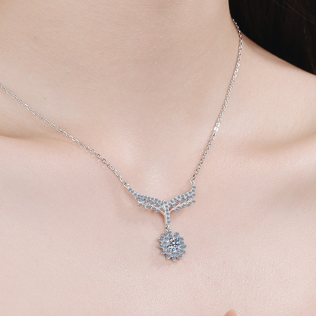 Angel Wing Moissanite Pendant Necklace with CZ in Rhodium-Plated S925 sterling silver worn on neckline by model showing scale and adjustable chain styling
