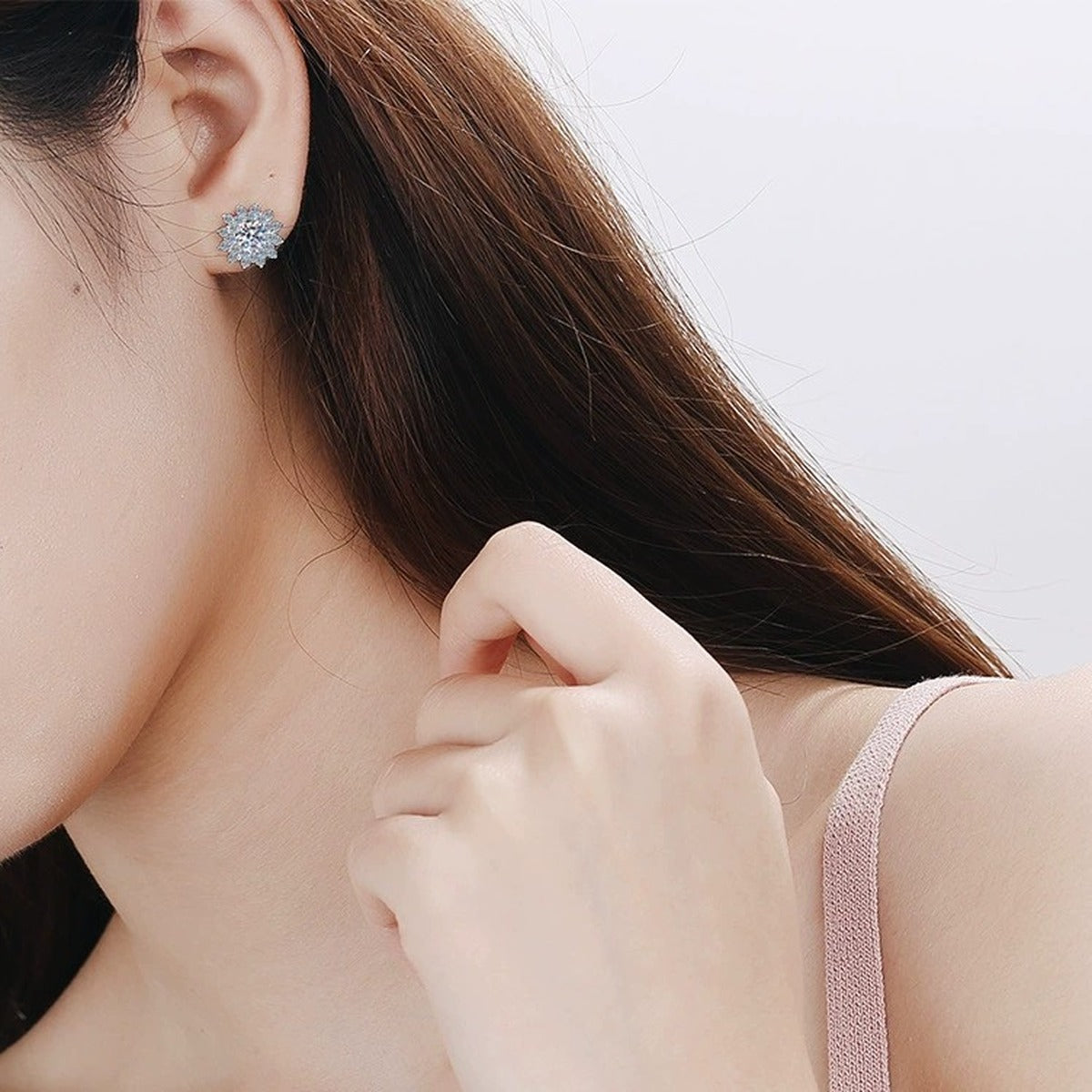 Floral Halo Moissanite Stud Earrings with CZ in Rhodium-Plated S925 Sterling Silver worn on ear by model to show scale, drop length, and everyday styling