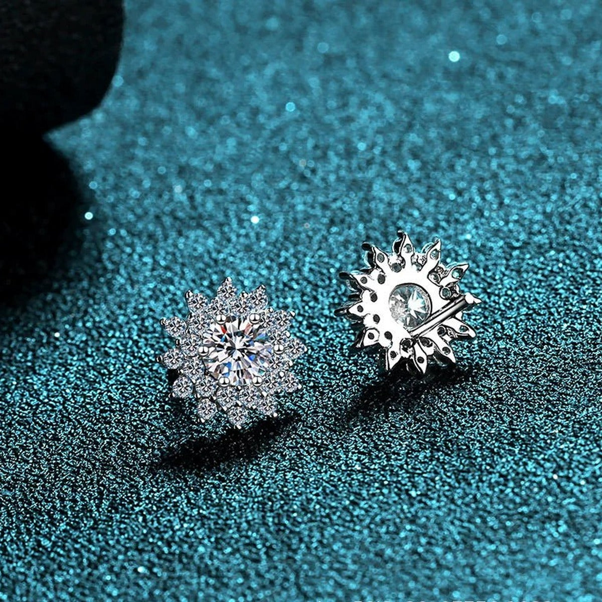 Floral Halo Moissanite Stud Earrings with CZ in Rhodium-Plated S925 Sterling Silver on blue-green fabric showing front detail