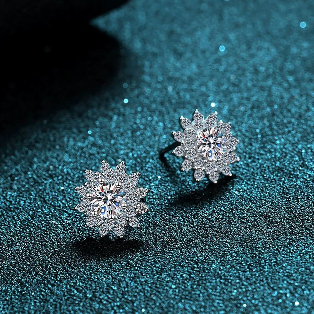 Floral Halo Moissanite Stud Earrings with CZ in Rhodium-Plated S925 Sterling Silver on blue-green fabric showing side profile and stone setting