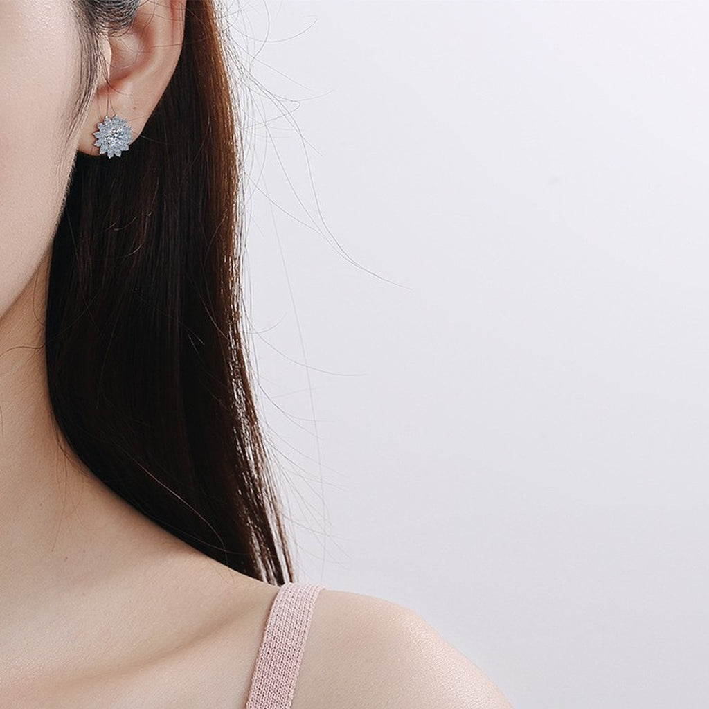 Floral Halo Moissanite Stud Earrings with CZ in Rhodium-Plated S925 Sterling Silver worn on ear by model to show scale, drop length, and everyday styling