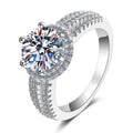 Round Moissanite Side Stone Ring with CZ in rhodium-plated S925 sterling silver on clean white background