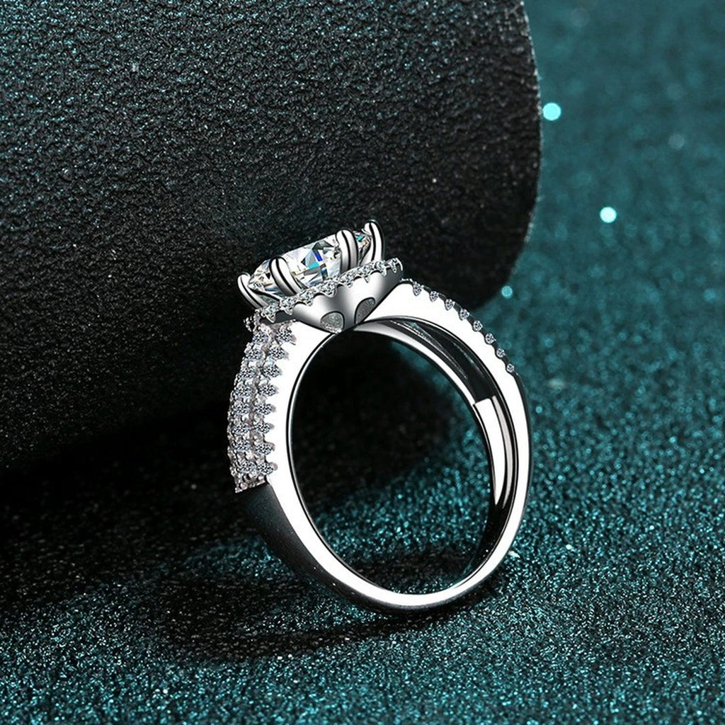 Round Moissanite Side Stone Ring with CZ product view showing moissanite setting and metal finish
