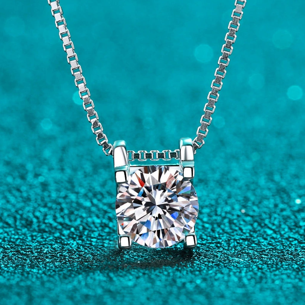 Solitaire and Cross Round Moissanite Pendant Necklace in Rhodium-Plated S925 sterling silver close-up product scene showing pendant setting