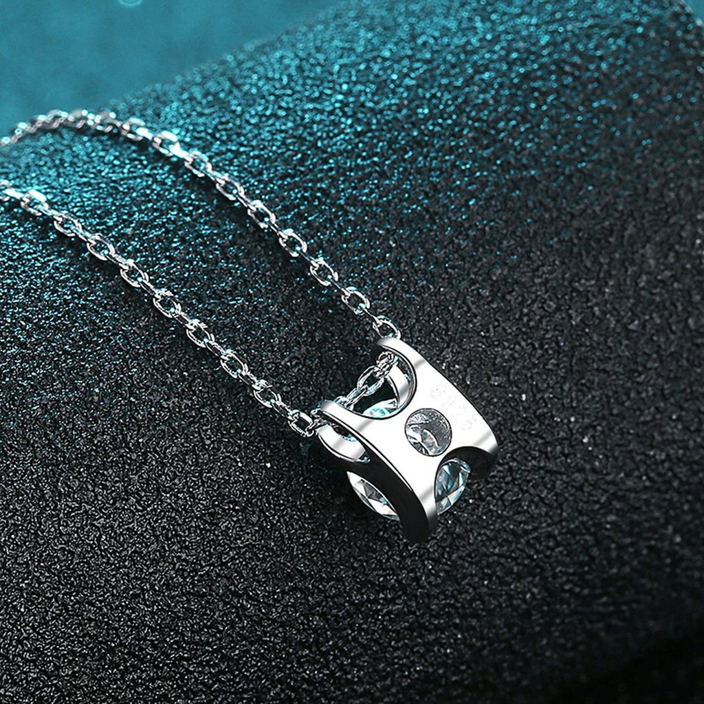 Solitaire and Cross Round Moissanite Pendant Necklace in Rhodium-Plated S925 sterling silver angled product detail view