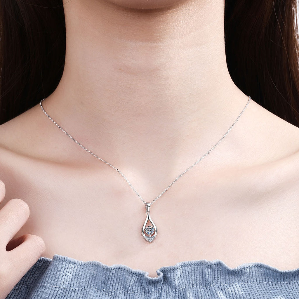 Teardrop Moissanite Pendant Necklace with CZ in Rhodium-Plated S925 sterling silver worn on neckline by model showing scale and adjustable chain styling