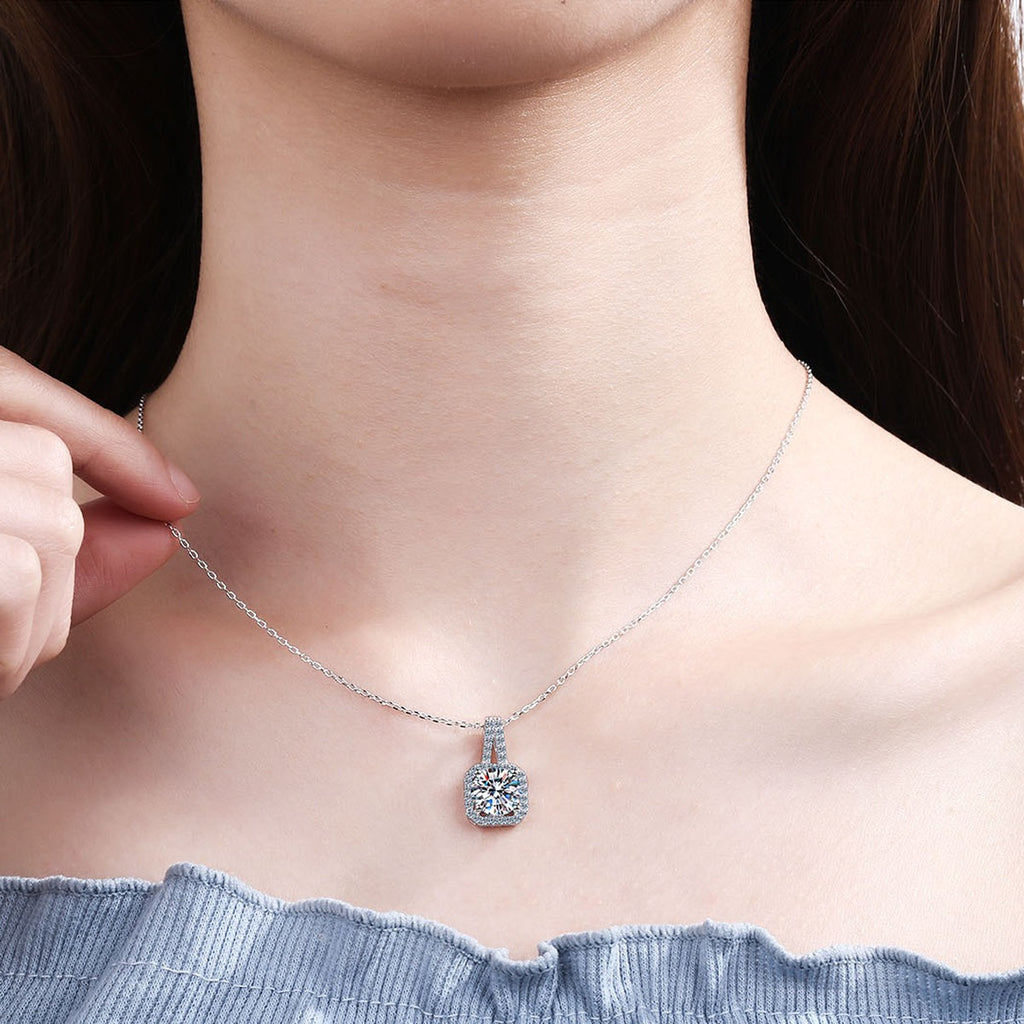 Solitaire Moissanite Pendant Necklace with CZ in Rhodium-Plated S925 sterling silver worn on neckline by model showing scale and adjustable chain styling
