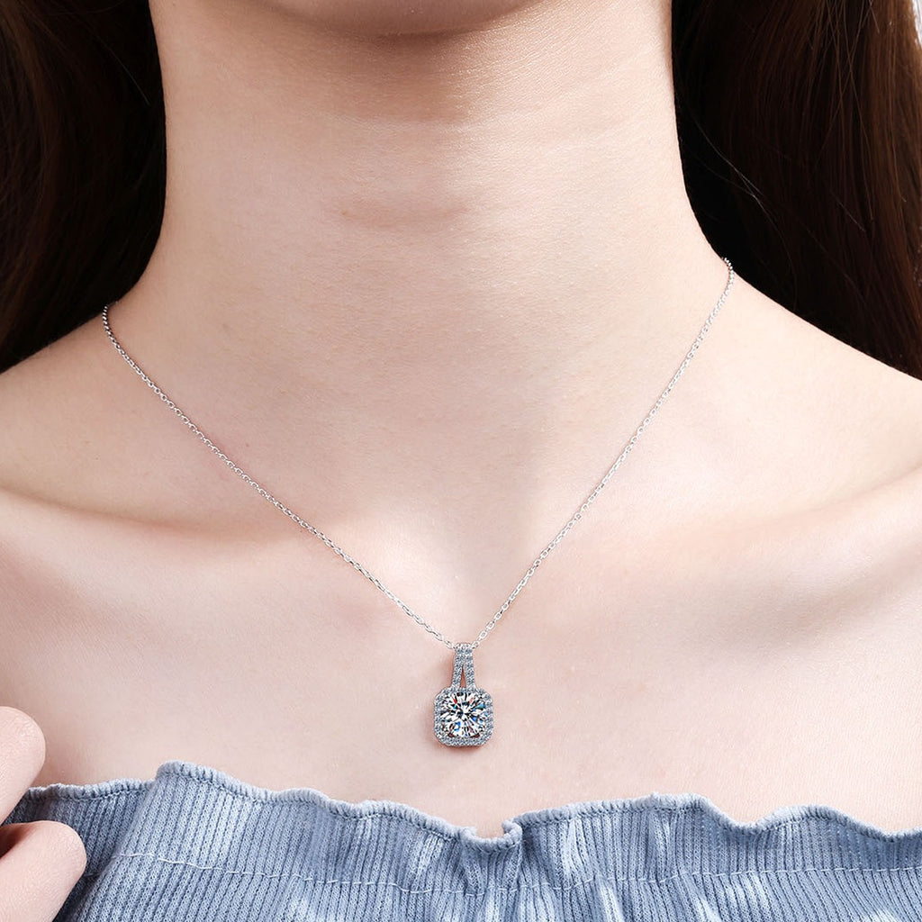 Solitaire Moissanite Pendant Necklace with CZ in Rhodium-Plated S925 sterling silver worn on neckline by model showing scale and adjustable chain styling