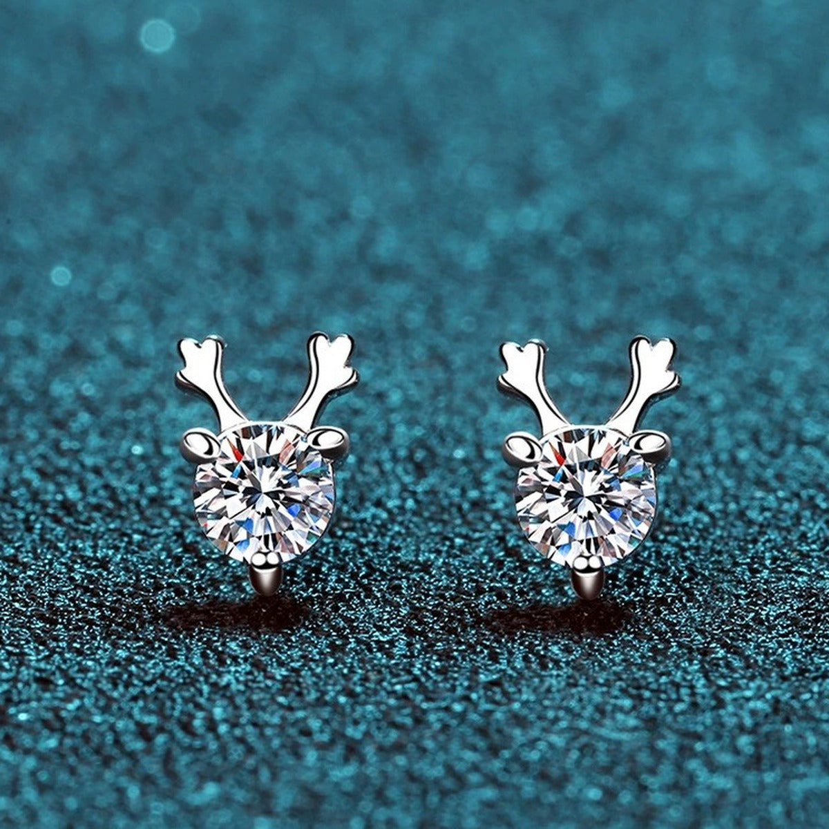 Deer Antler Moissanite Stud Earrings in Rhodium-Plated S925 Sterling Silver on blue-green fabric showing front detail