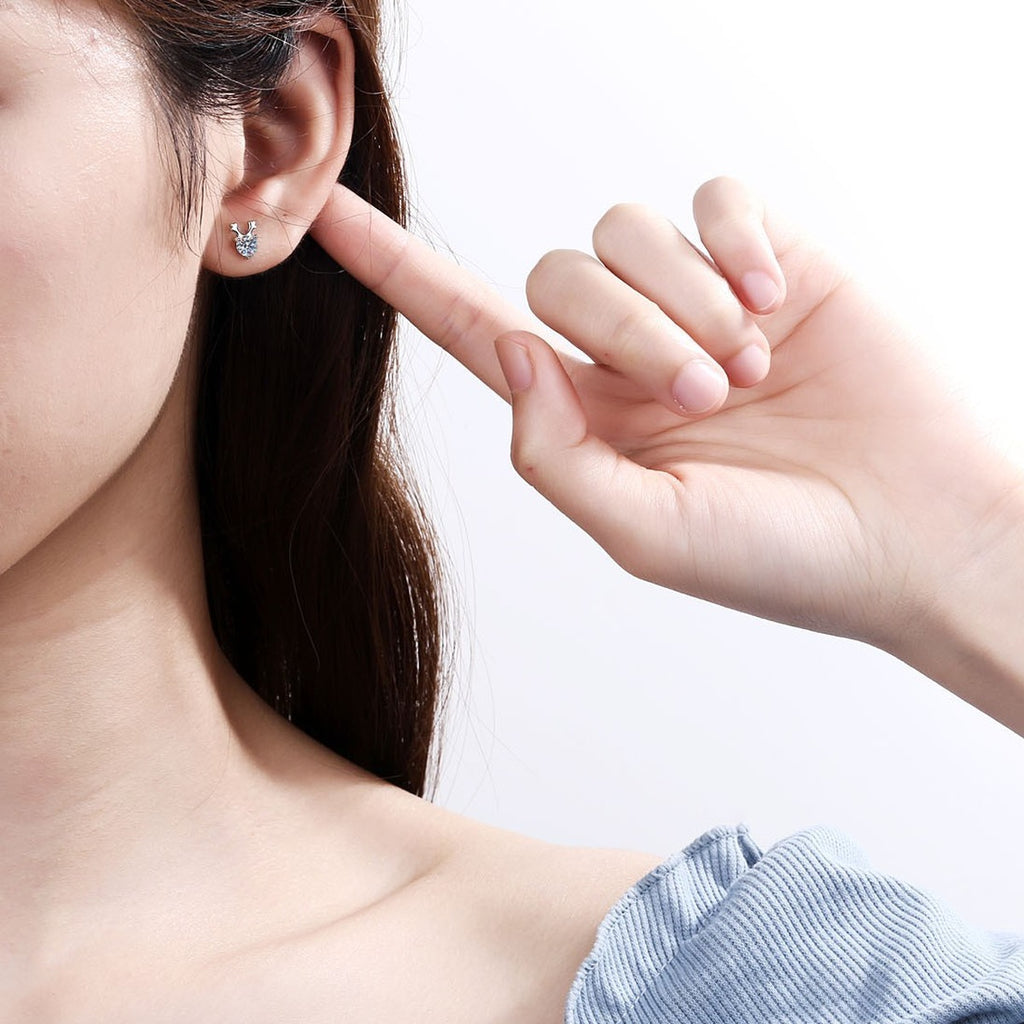 Deer Antler Moissanite Stud Earrings in Rhodium-Plated S925 Sterling Silver worn on ear by model to show scale, drop length, and everyday styling
