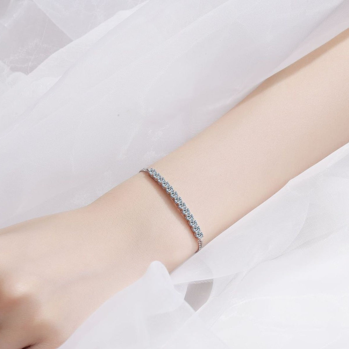 Mini Tennis Moissanite Adjustable Bracelet in Rhodium-Plated S925 sterling silver worn on wrist model view showing scale and adjustable fit