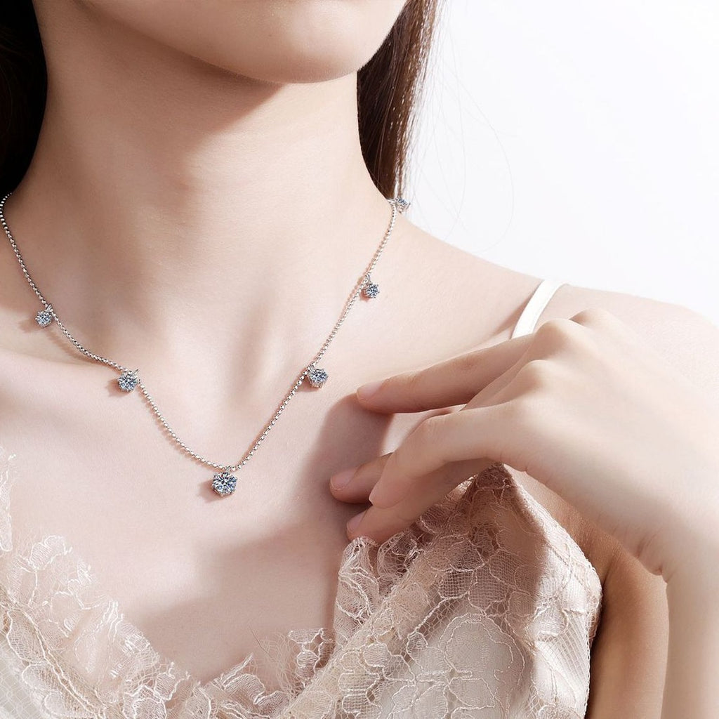 Charm Station Moissanite Necklace with CZ in Rhodium-Plated S925 sterling silver worn on neckline by model showing scale and adjustable chain styling