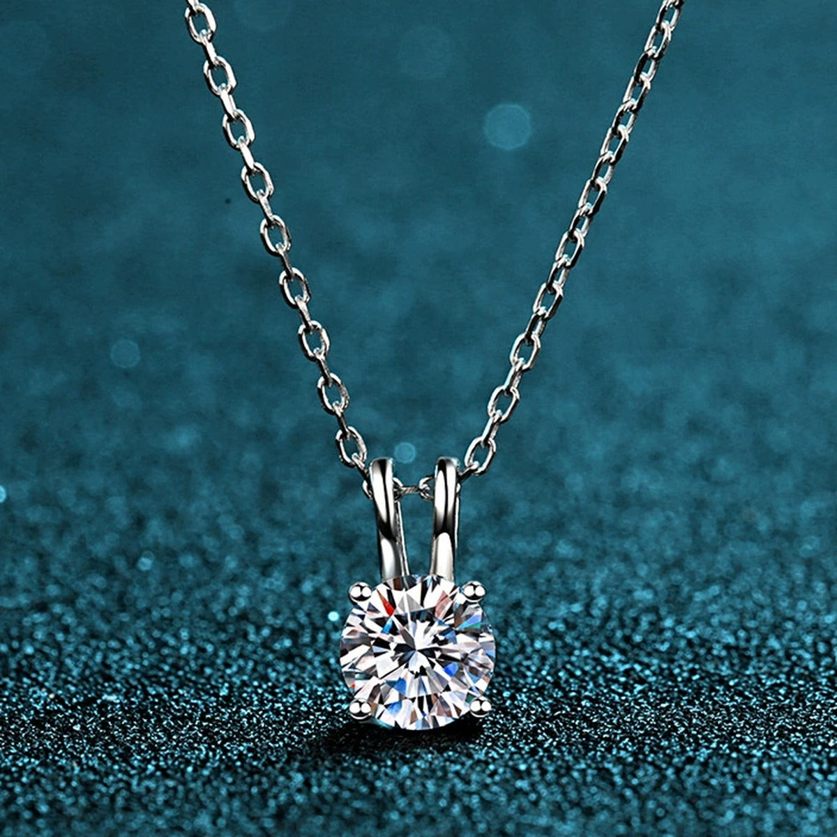 Solitaire Moissanite Pendant Necklace in Rhodium-Plated S925 sterling silver product scene view showing chain and setting detail