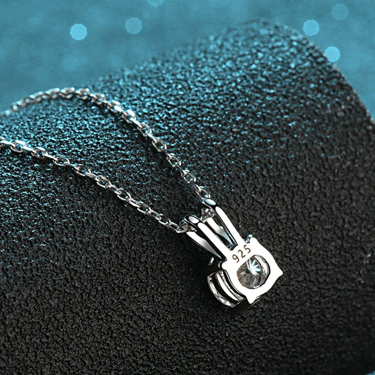 Solitaire Moissanite Pendant Necklace in Rhodium-Plated S925 sterling silver product scene view showing angled sparkle