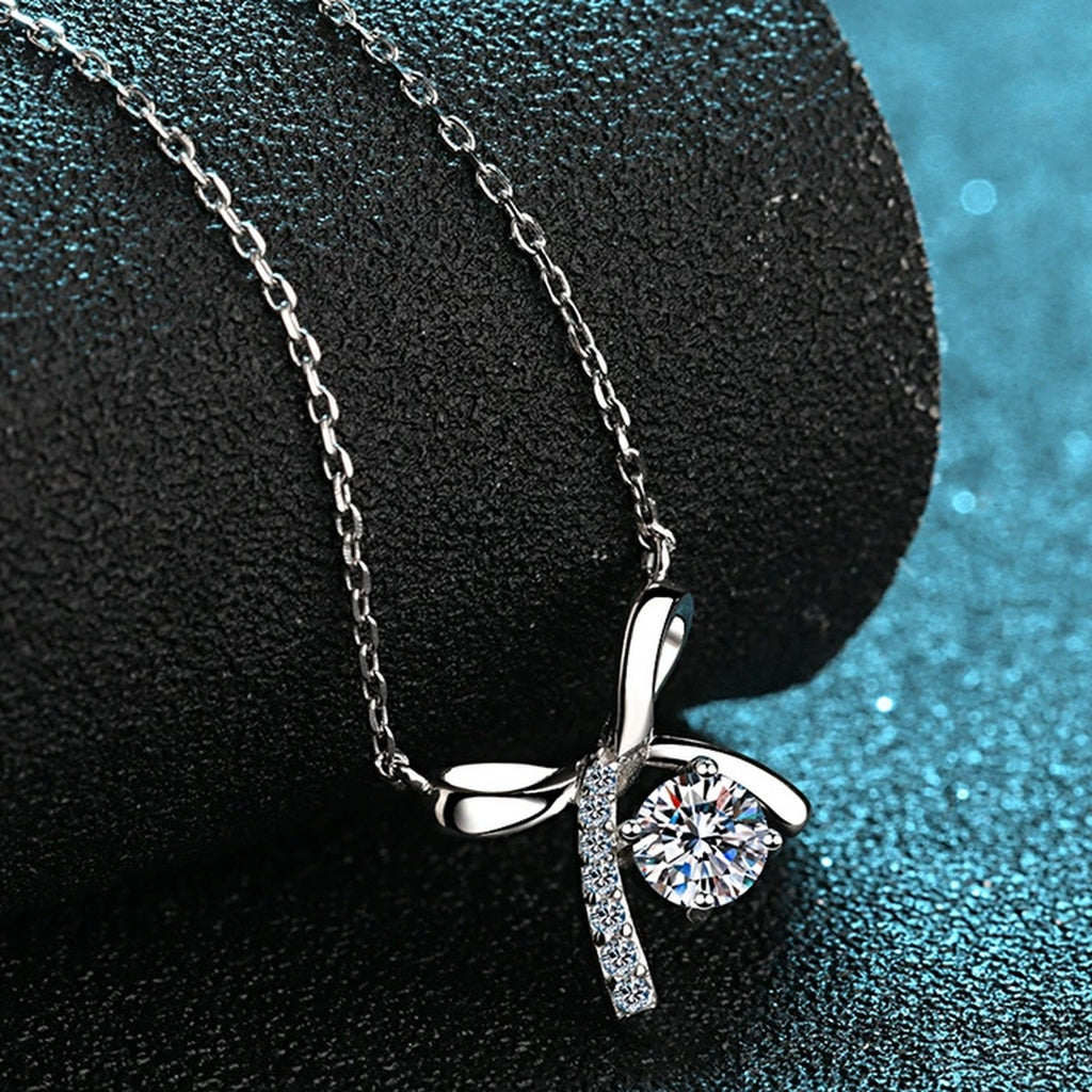 Ribbon Bow Moissanite Pendant Necklace with CZ in Rhodium-Plated S925 sterling silver product scene view showing angled sparkle