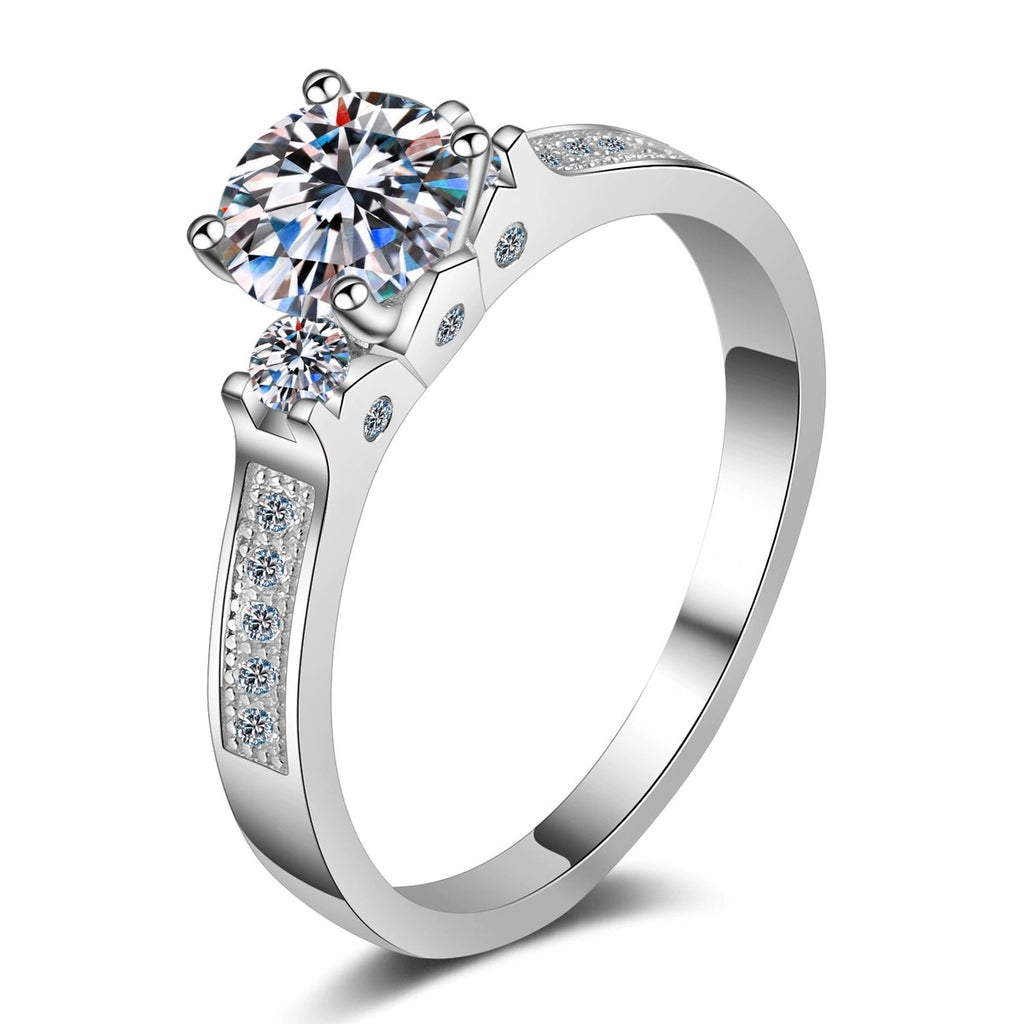 Round Moissanite Side Stone Engagement Ring with CZ in rhodium-plated S925 sterling silver on clean white background