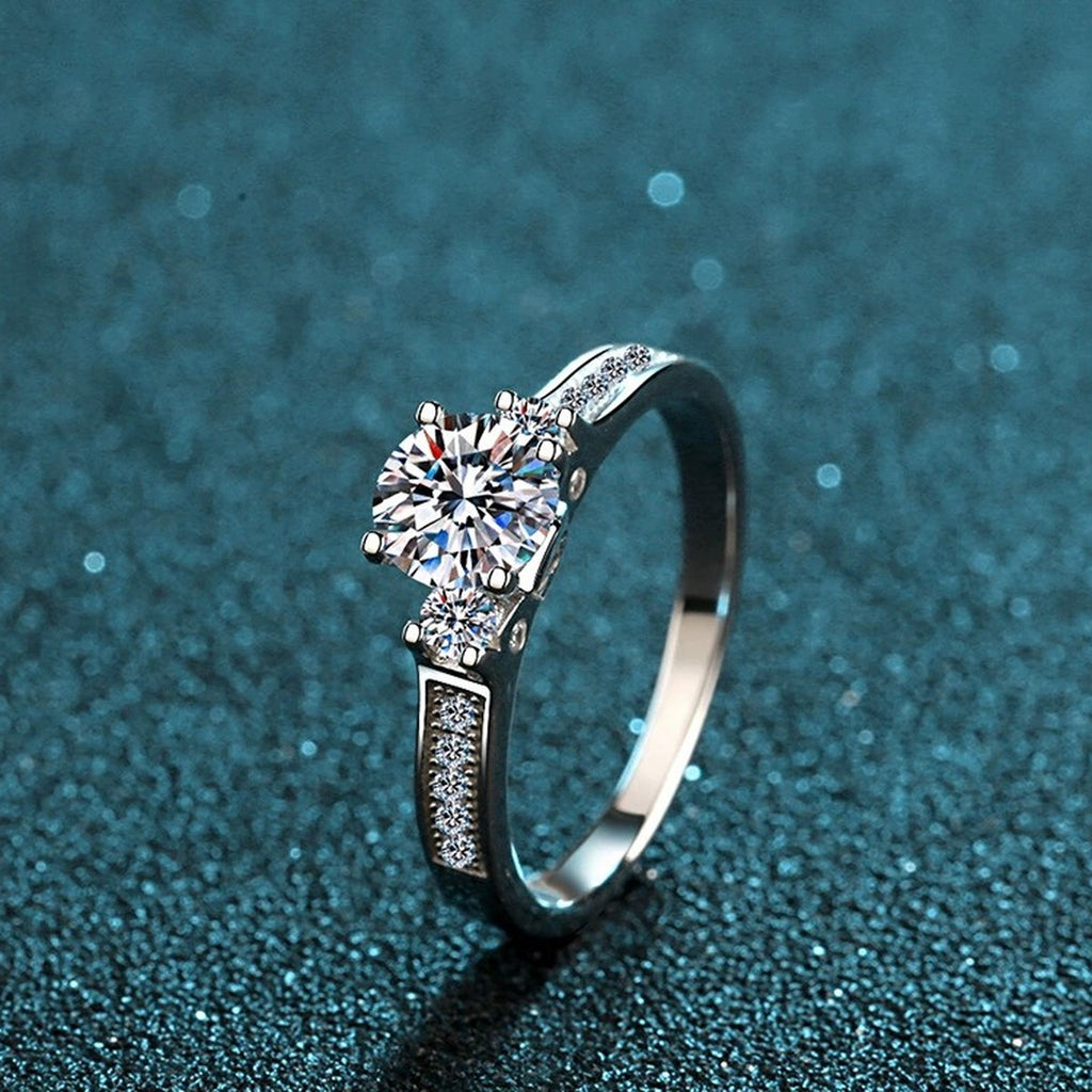 Round Moissanite Side Stone Engagement Ring with CZ product view showing moissanite setting and metal finish