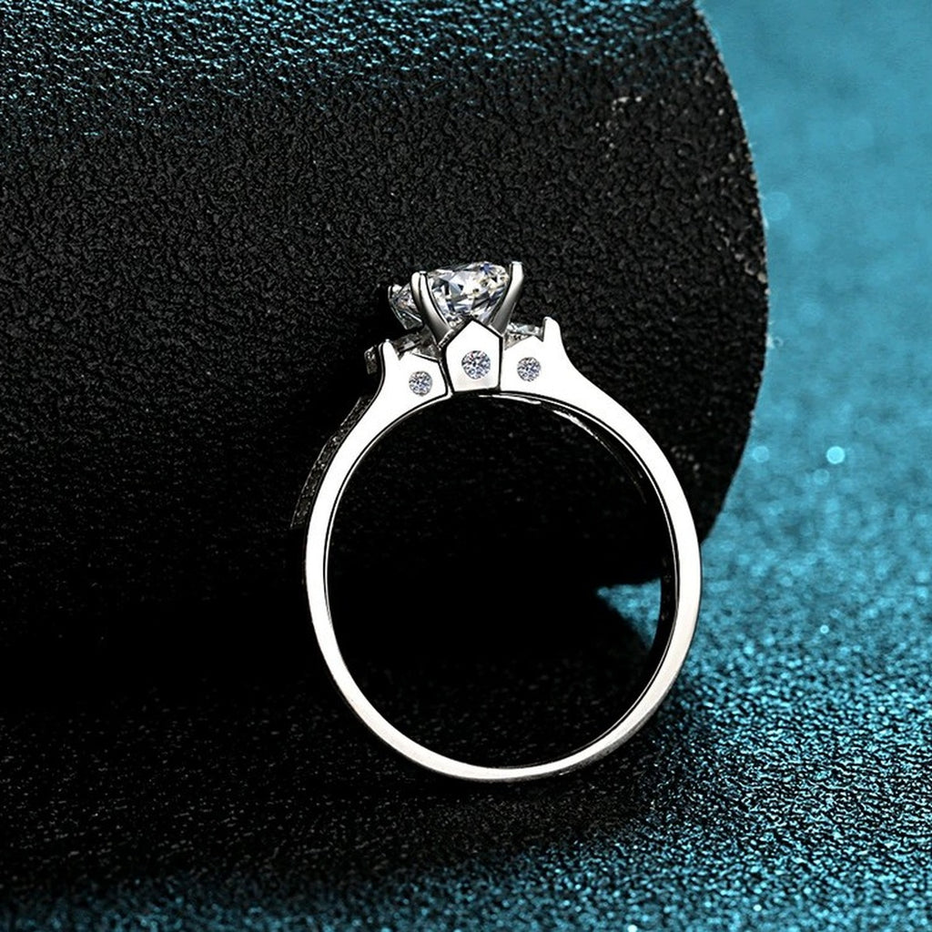 Round Moissanite Side Stone Engagement Ring with CZ product view showing moissanite setting and metal finish