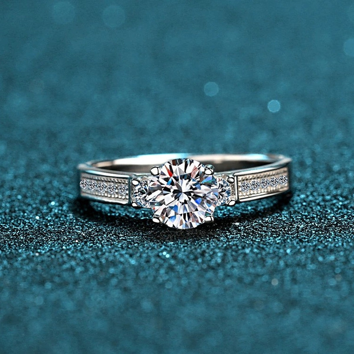Round Moissanite Side Stone Engagement Ring with CZ product view showing moissanite setting and metal finish