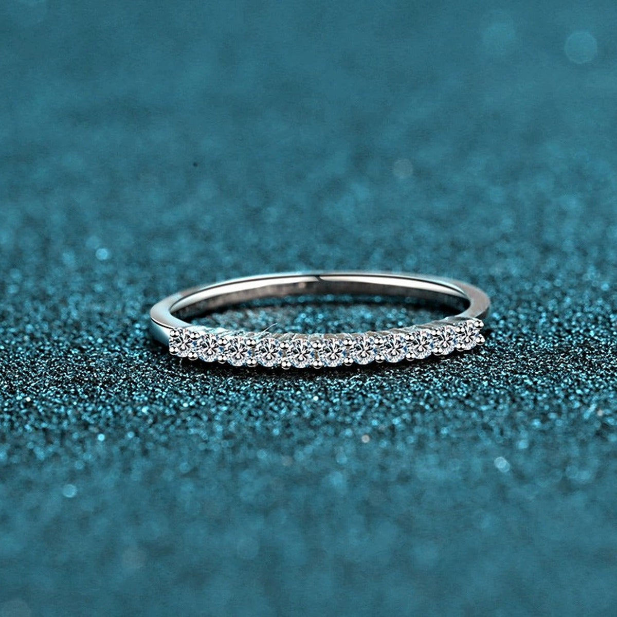 Round Moissanite Stackable Band Ring product view showing moissanite setting and metal finish